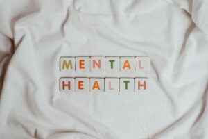 the phrase mental health on a sheet of fabric