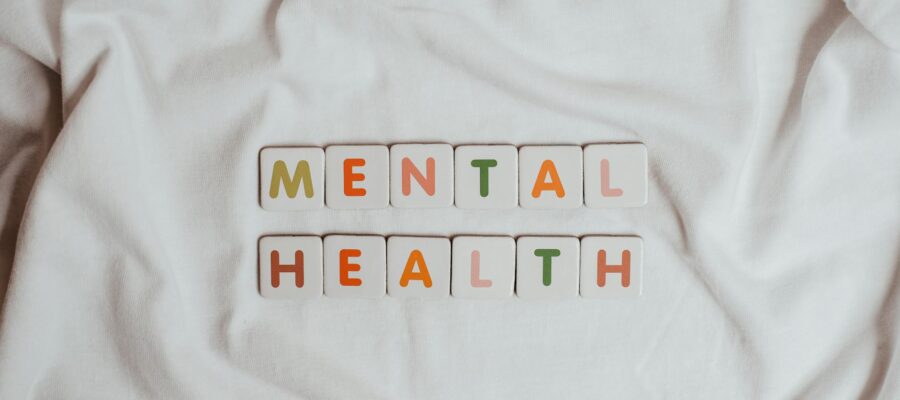 the phrase mental health on a sheet of fabric